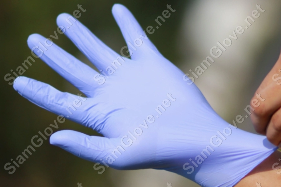 Blue disposable medical glove for health and laboratory use.