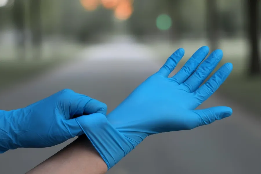 Blue disposable medical glove for health and laboratory use.